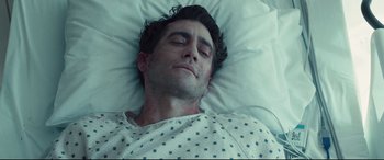 Movie still from “Stronger” (2017), directed by David Gordon Green – A person laying in a hospital bed; Close Up shot, Overhead angle