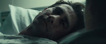 Movie still from “Stronger” (2017), directed by David Gordon Green – A person laying in a hospital bed; Close Up shot, Low angle
