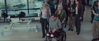 Movie still from “Stronger” (2017), directed by David Gordon Green – A man sitting in a wheel chair in front of a group of people; Wide shot, High angle