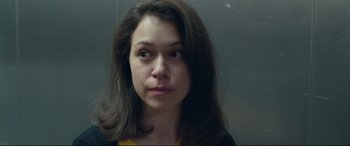Movie still from “Stronger” (2017), directed by David Gordon Green – A person with long brown hair; Close Up shot, Over the shoulder angle