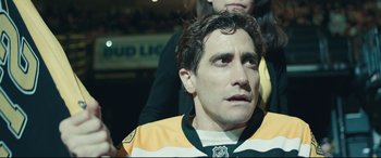 Movie still from “Stronger” (2017), directed by David Gordon Green – A person wearing a hockey jersey; Close Up shot, Over the shoulder angle