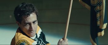 Movie still from “Stronger” (2017), directed by David Gordon Green – A person holding a wooden stick; Close Up shot, Low angle