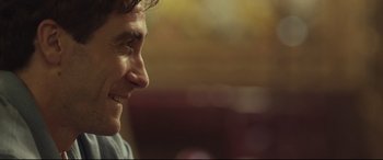 Movie still from “Stronger” (2017), directed by David Gordon Green – A man's face in a dark room; Close Up shot, Over the shoulder angle