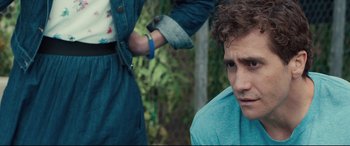 Movie still from “Stronger” (2017), directed by David Gordon Green – A man standing next to another man in a blue shirt; Close Up shot, Over the shoulder angle