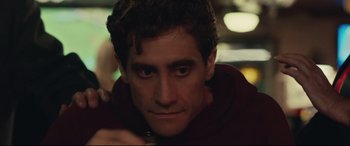 Movie still from “Stronger” (2017), directed by David Gordon Green – A person with a red shirt on; Close Up shot, Over the shoulder angle