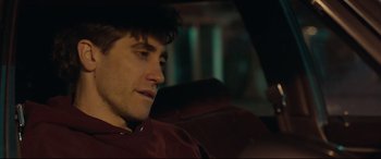 Movie still from “Stronger” (2017), directed by David Gordon Green – A man sitting in the back seat of a car; Close Up shot, Over the shoulder angle