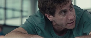 Movie still from “Stronger” (2017), directed by David Gordon Green – A man's face as he looks at the camera; Close Up shot, Low angle