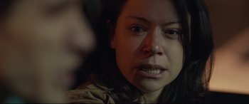 Movie still from “Stronger” (2017), directed by David Gordon Green – A woman's face in the dark; Close Up shot, Over the shoulder angle