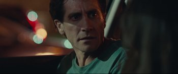 Movie still from “Stronger” (2017), directed by David Gordon Green – A person wearing a green shirt; Close Up shot, Over the shoulder angle