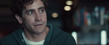 Movie still from “Stronger” (2017), directed by David Gordon Green – A person wearing a hoodie; Close Up shot, Over the shoulder angle