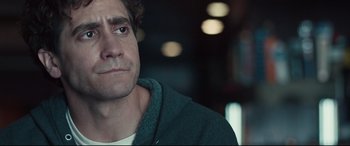 Movie still from “Stronger” (2017), directed by David Gordon Green – A man's face in a dark room; Close Up shot, Over the shoulder angle