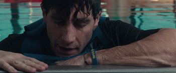 Movie still from “Stronger” (2017), directed by David Gordon Green – A person wearing a bracelet; Close Up shot, Low angle
