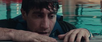 Movie still from “Stronger” (2017), directed by David Gordon Green – A man in the water with his eyes closed; Close Up shot, High angle