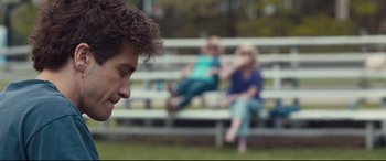 Movie still from “Stronger” (2017), directed by David Gordon Green – Two women and a man sitting on a park bench; Close Up shot, Over the shoulder angle