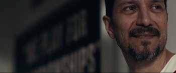 Movie still from “Stronger” (2017), directed by David Gordon Green – A man's face in front of a wall; Close Up shot, Low angle