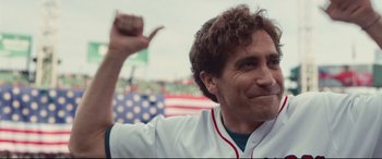 Movie still from “Stronger” (2017), directed by David Gordon Green – A man in a baseball uniform raising his hand; Close Up shot, Low angle