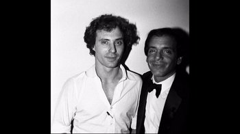 A couple of men standing next to each other