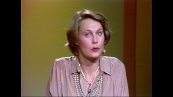Movie still from “Studio 54” (2018), directed by Matt Tyrnauer – An older woman wearing a brown shirt and a necklace; Close Up shot, High angle