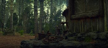 Movie still from “Sweet Tooth” (2021), created by Jim Mickle – An old wooden structure in the middle of a forest; Extreme Wide shot, High angle