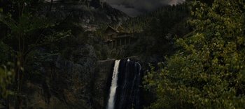 Movie still from “Sweet Tooth” (2021), created by Jim Mickle – A waterfall in the middle of the night; Extreme Wide shot, Low angle