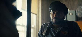 Movie still from “Sweet Tooth” (2021), created by Jim Mickle – A man wearing a hat and a jacket; Close Up shot, Low angle