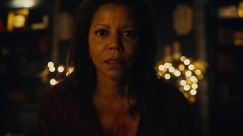 Movie still from “Mr. Robot” (2015), created by Sam Esmail – A woman in a dark room with lights in the background; Close Up shot, Low angle