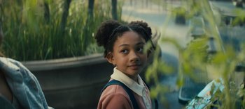 Movie still from “Sweet Tooth” (2021), created by Jim Mickle – A young girl is standing in front of some plants; Close Up shot, High angle