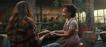 Movie still from “Sweet Tooth” (2021), created by Jim Mickle – A woman sitting next to a woman holding her hands; Medium shot, Over the shoulder angle