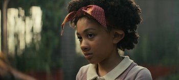 Movie still from “Sweet Tooth” (2021), created by Jim Mickle – A young girl with a polka dot bow on her head; Close Up shot, Low angle