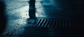 Movie still from “Sweet Tooth” (2021), created by Jim Mickle – A metal grate on the ground; Extreme Close Up shot, High angle