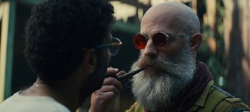 Movie still from “Sweet Tooth” (2021), created by Jim Mickle – An older man with a long white beard is looking at a younger man with a long white beard; Close Up shot, Low angle