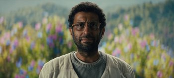 Movie still from “Sweet Tooth” (2021), created by Jim Mickle – A person wearing glasses and a sweater; Close Up shot, Low angle