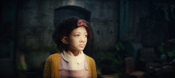 Movie still from “Sweet Tooth” (2021), created by Jim Mickle – A young girl is standing in front of a brick wall; Close Up shot, Low angle