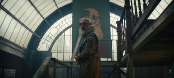 Movie still from “Sweet Tooth” (2021), created by Jim Mickle – An old man with a long white beard wearing sunglasses; Wide shot, Low angle