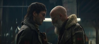Movie still from “Sweet Tooth” (2021), created by Jim Mickle – A man and a man with long white hair and glasses looking at each other; Close Up shot, Over the shoulder angle