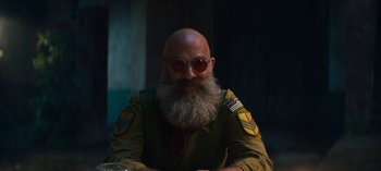 Movie still from “Sweet Tooth” (2021), created by Jim Mickle – A bald man with a beard and sunglasses; Close Up shot, Over the shoulder angle