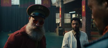 Movie still from “Sweet Tooth” (2021), created by Jim Mickle – A man with a long beard and a man with a hat and sunglasses; Medium shot, Low angle