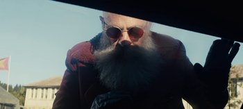 Movie still from “Sweet Tooth” (2021), created by Jim Mickle – An old man with a long beard wearing sunglasses; Close Up shot, Low angle