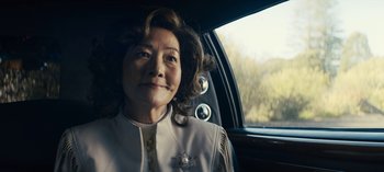 Movie still from “Sweet Tooth” (2021), created by Jim Mickle – An older woman sitting in the driver's seat of a car; Close Up shot, Over the shoulder angle