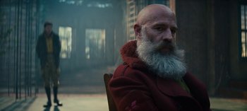 Movie still from “Sweet Tooth” (2021), created by Jim Mickle – A man with a beard and a red coat; Close Up shot, Over the shoulder angle