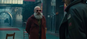 Movie still from “Sweet Tooth” (2021), created by Jim Mickle – A man with a beard and a red coat; Medium shot, Over the shoulder angle