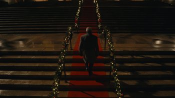 Movie still from “Mr. Robot” (2015), created by Sam Esmail – A man walking down a red carpet on some steps; Extreme Wide shot, Low angle