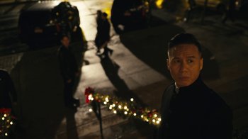 Movie still from “Mr. Robot” (2015), created by Sam Esmail – A man standing on the side of the street at night; Close Up shot, High angle