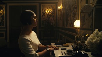 Movie still from “Mr. Robot” (2015), created by Sam Esmail – A woman sitting at a table in front of a computer; Medium shot, Over the shoulder angle