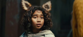 Movie still from “Sweet Tooth” (2021), created by Jim Mickle – A young girl wearing animal ears and a scarf; Close Up shot, Over the shoulder angle