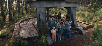 Movie still from “Sweet Tooth” (2021), created by Jim Mickle – A group of people standing next to each other on a bridge; Wide shot, High angle