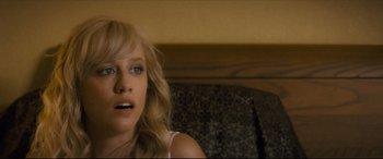 Movie still from “Synchronic” (2019), directed by Justin Benson – A person with blonde hair; Close Up shot, Over the shoulder angle