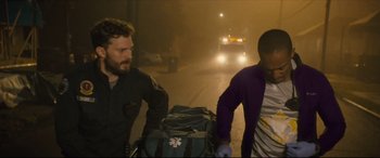 Movie still from “Synchronic” (2019), directed by Justin Benson – Two men walking down a street with a suitcase; Medium shot, Over the shoulder angle