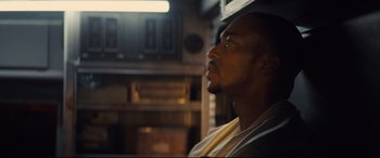 Movie still from “Synchronic” (2019), directed by Justin Benson – A person looking up at the sky; Close Up shot, Low angle