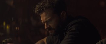 Movie still from “Synchronic” (2019), directed by Justin Benson – A person with a beard; Close Up shot, Over the shoulder angle